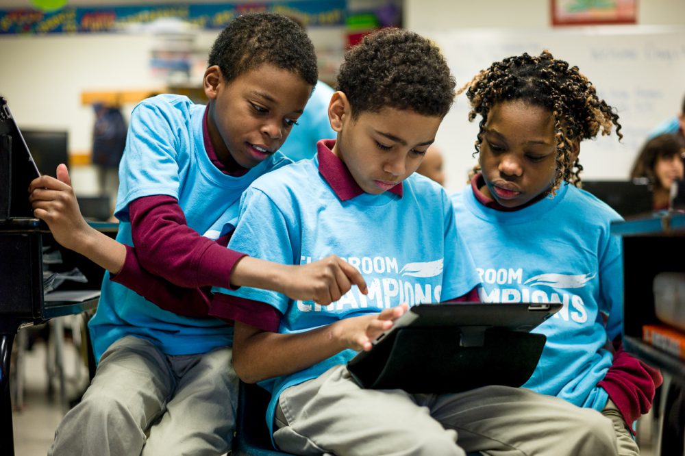 Fifth grade children at Northwood Academy Charter School in North Philadelphia, using iPads and laptops, completing another lesson using video from Google Glass made by Lex Gillette to learn about blindness. Children can see what he can’t to help with the aim of increasing children’s empathy and goal-setting skills. ©craegphoto